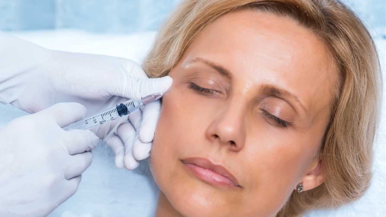 a girl taking Botox injection