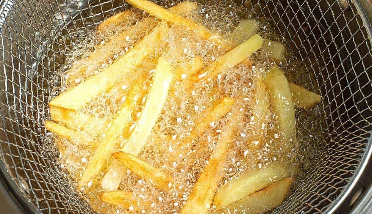 French fries in a fryer full of oil