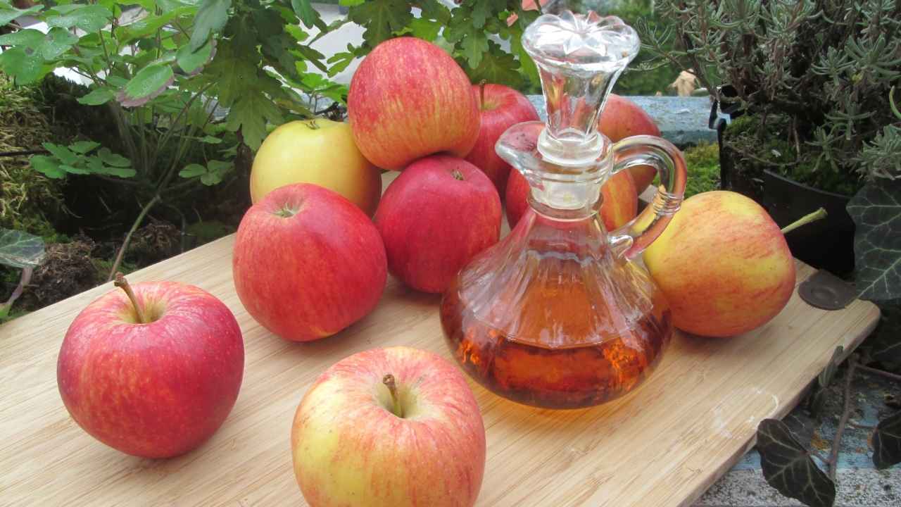 Apples and Apple Cider Vinegar On the Table
