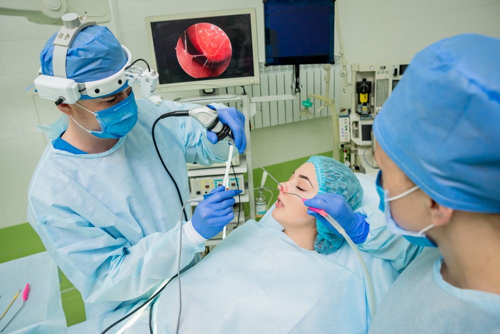 A surgeon performing endoscopic sinus surgery.