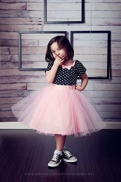 small girl wearing black and pink tutu dress with sneakers - sneaker ball outfit idea for kid